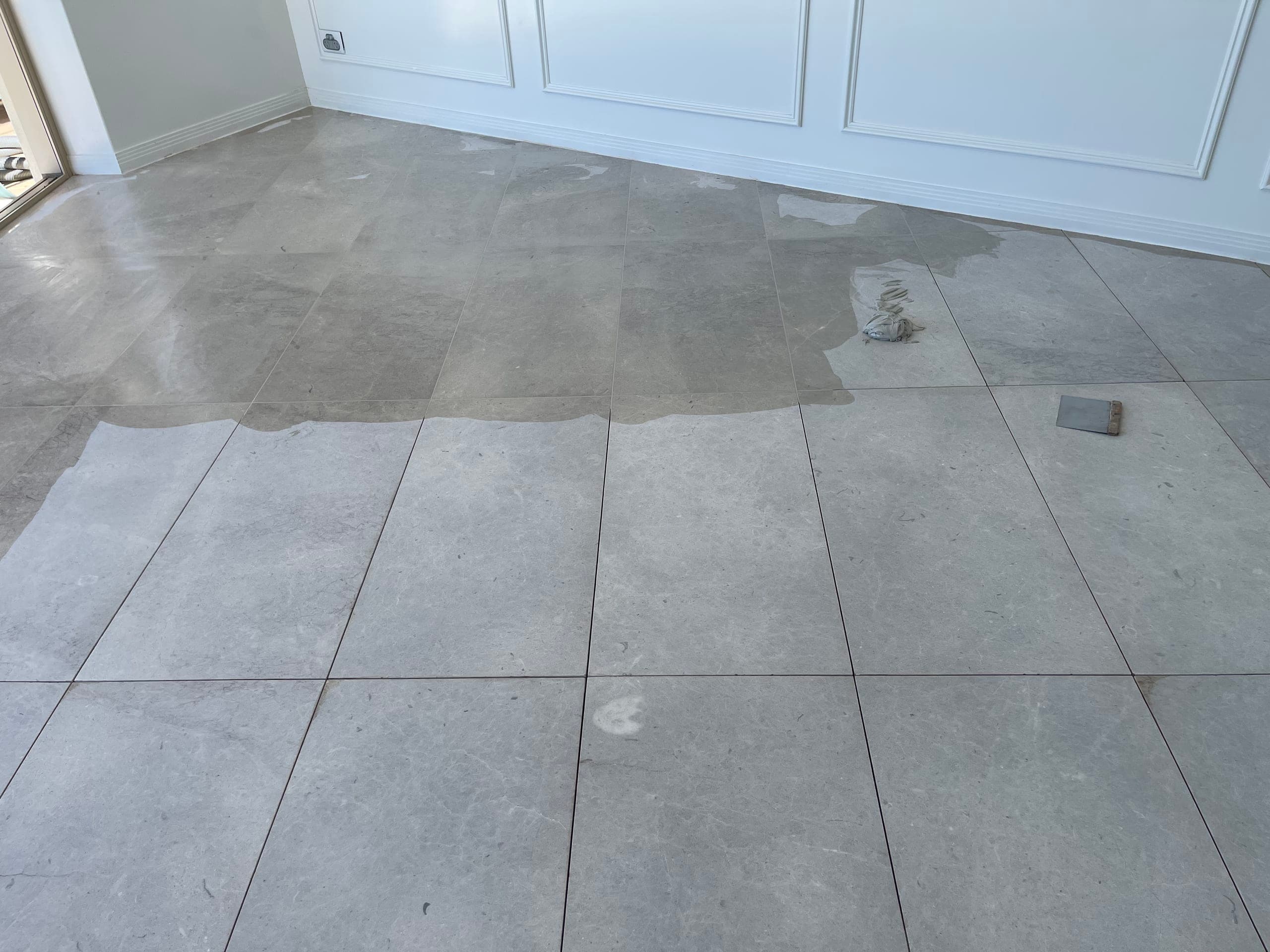 Marble floor with its joints being filled during restoration