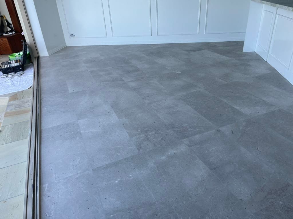 Second grinding stage refining the dining-area marble surface