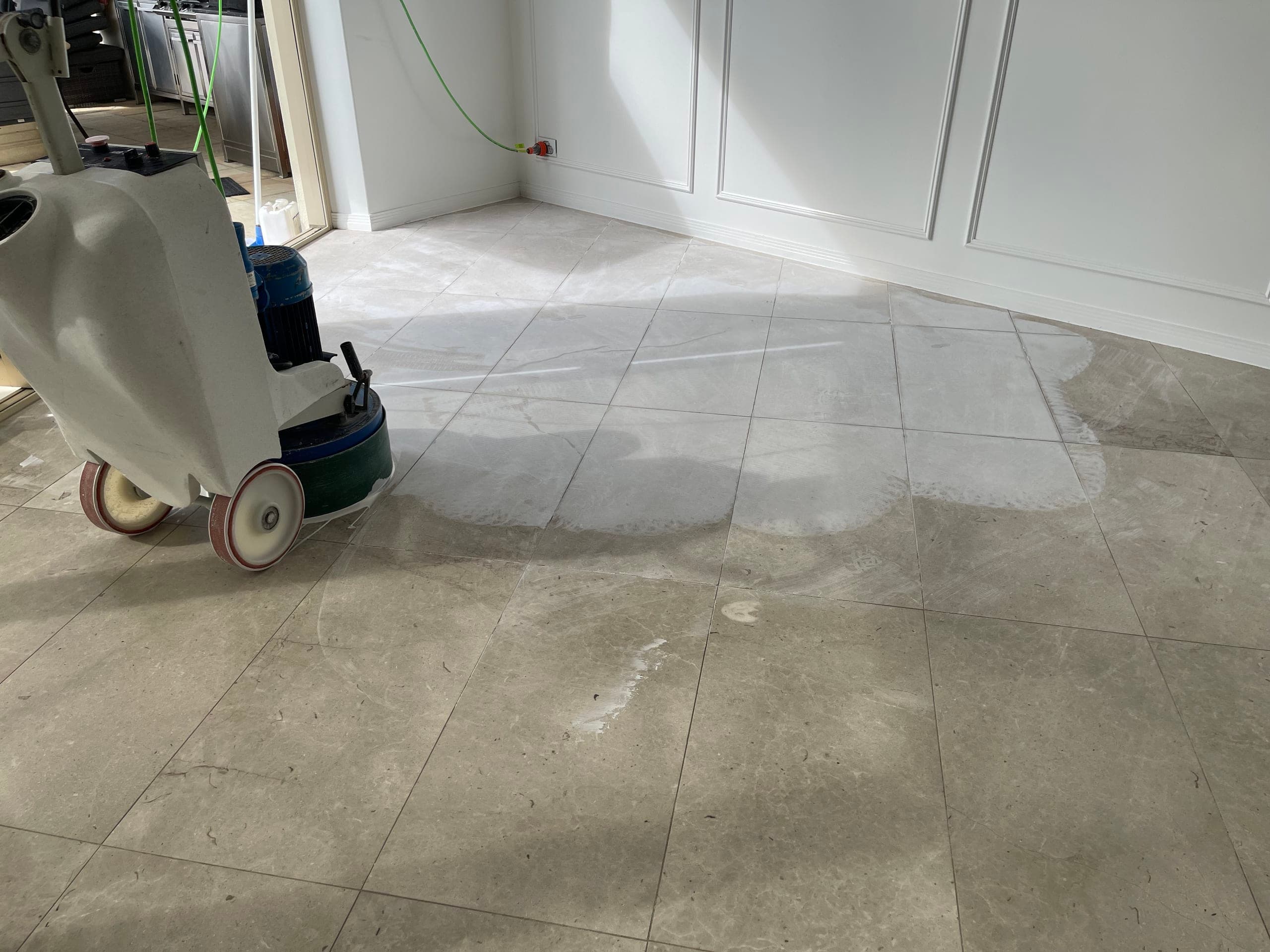 Dining-area marble floor before works, its surface flat and light-scattering