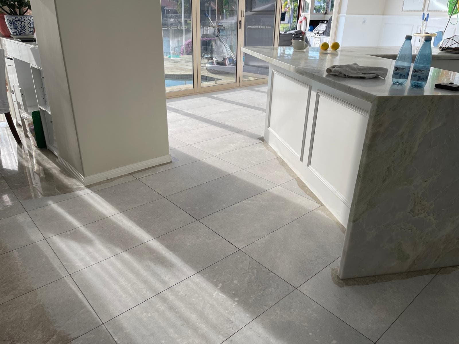 Grinding machine cutting the dining-area marble floor back to a matte finish