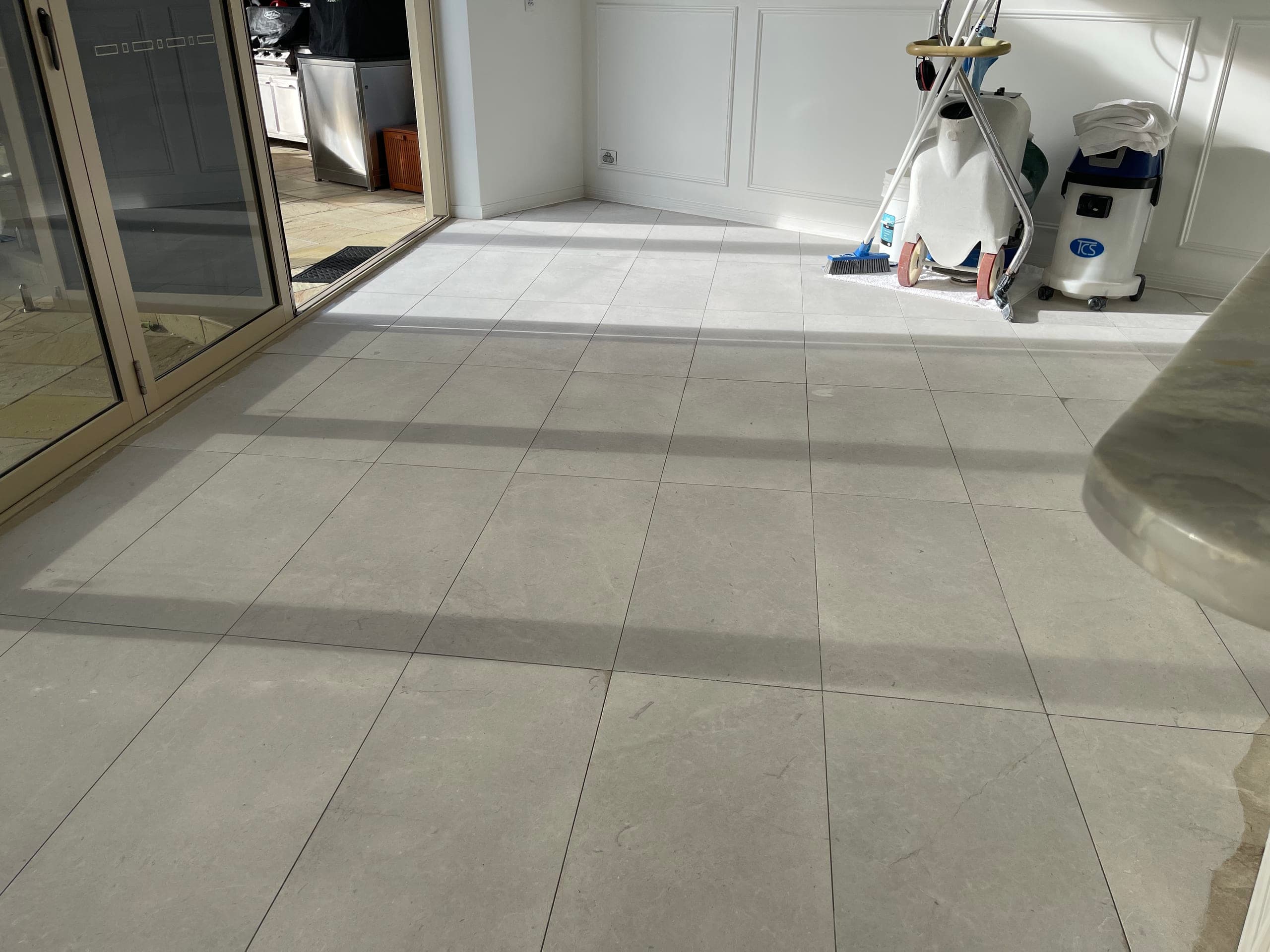 Even matte surface emerging on the dining floor during the first grind
