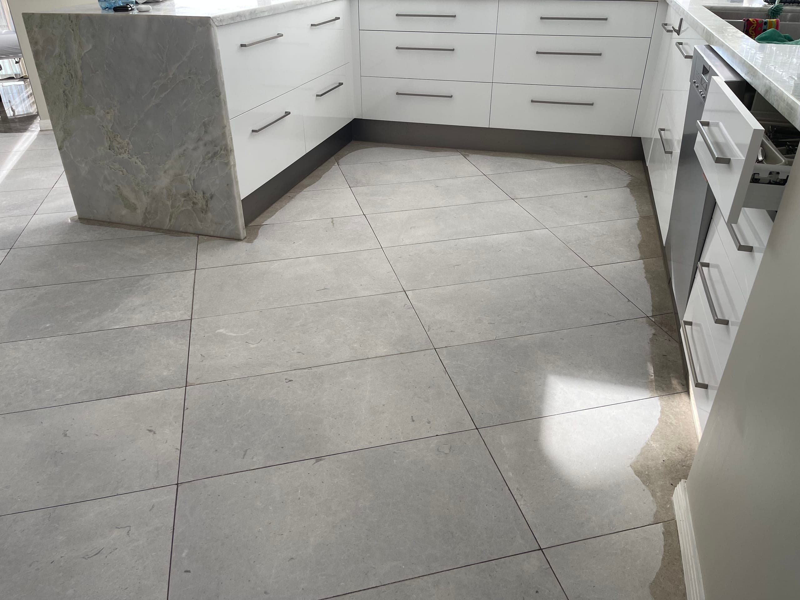 First grinding pass across the kitchen marble floor