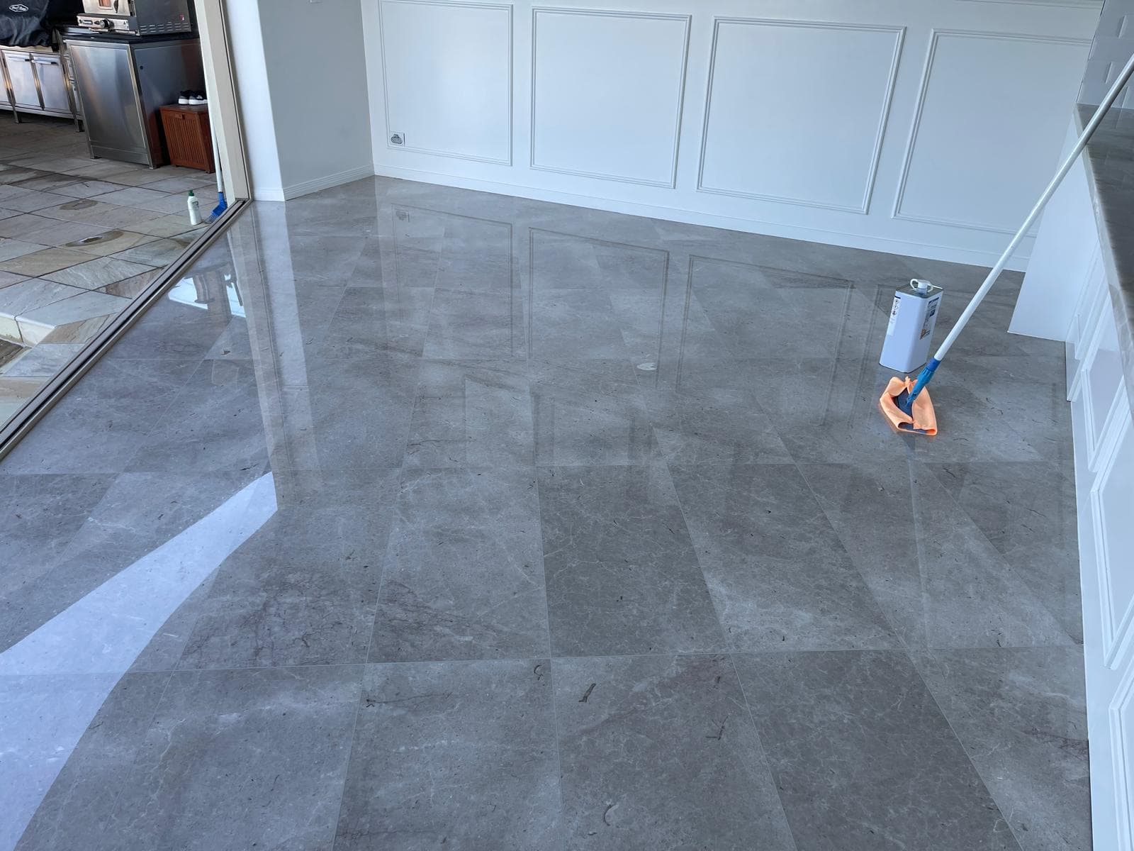 Impregnating sealer being applied to a restored marble floor