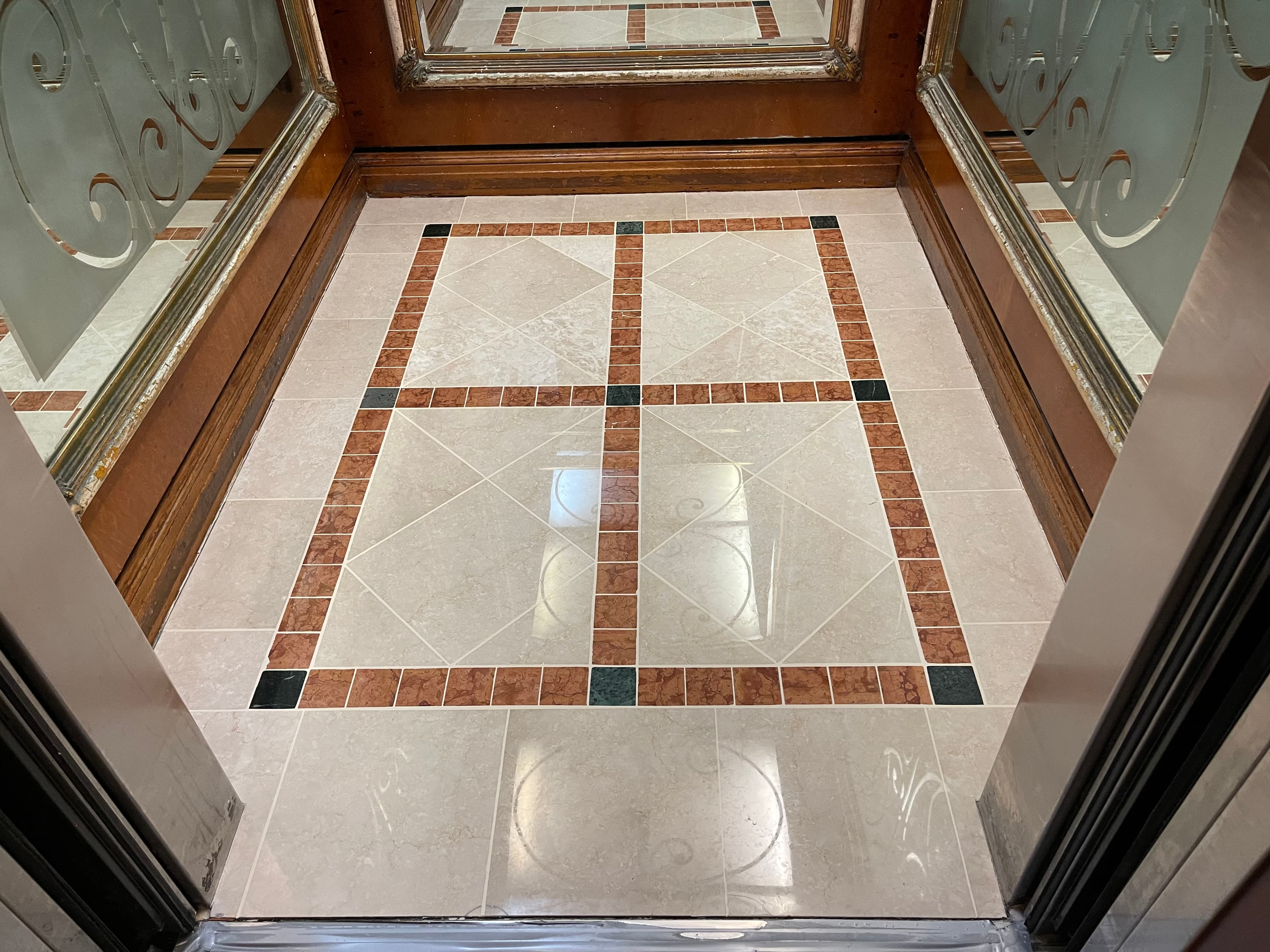 Stone restoration work inside an apartment building lift lobby