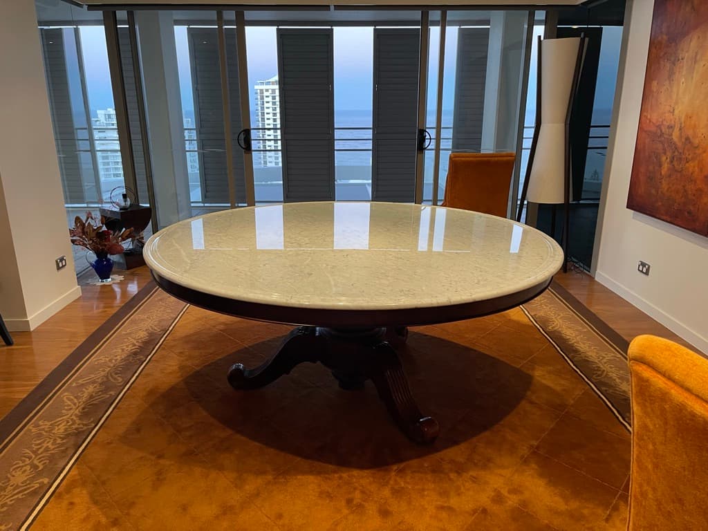 Travertine table top after filling, honing and finishing